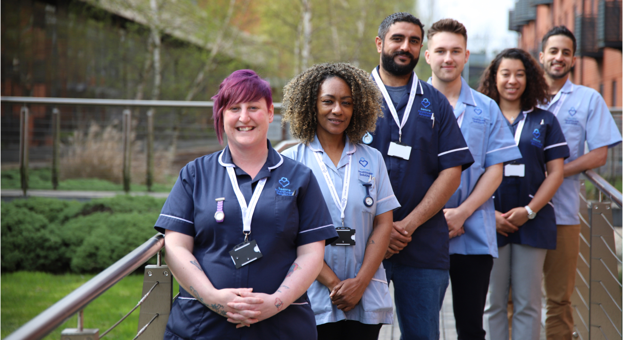 Hospital healthcare team supporting a patient
